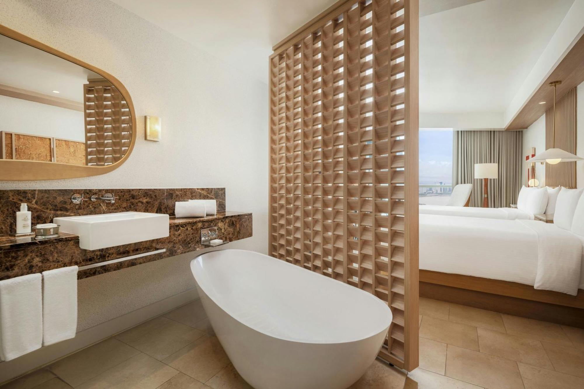 Guest room 2 double beds balcony partial ocean view