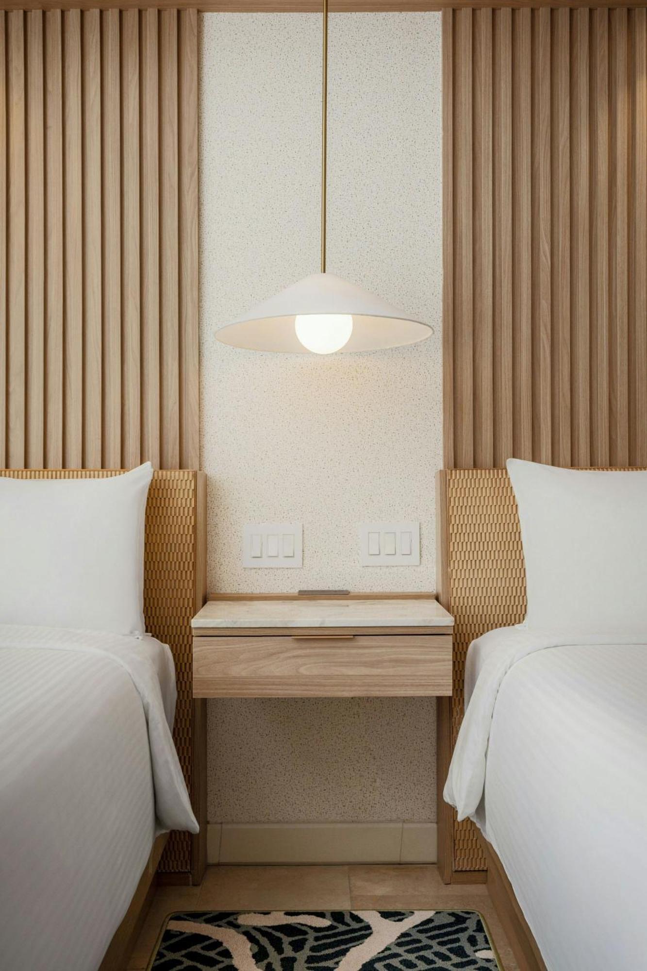 Guest room 2 double beds balcony partial ocean view