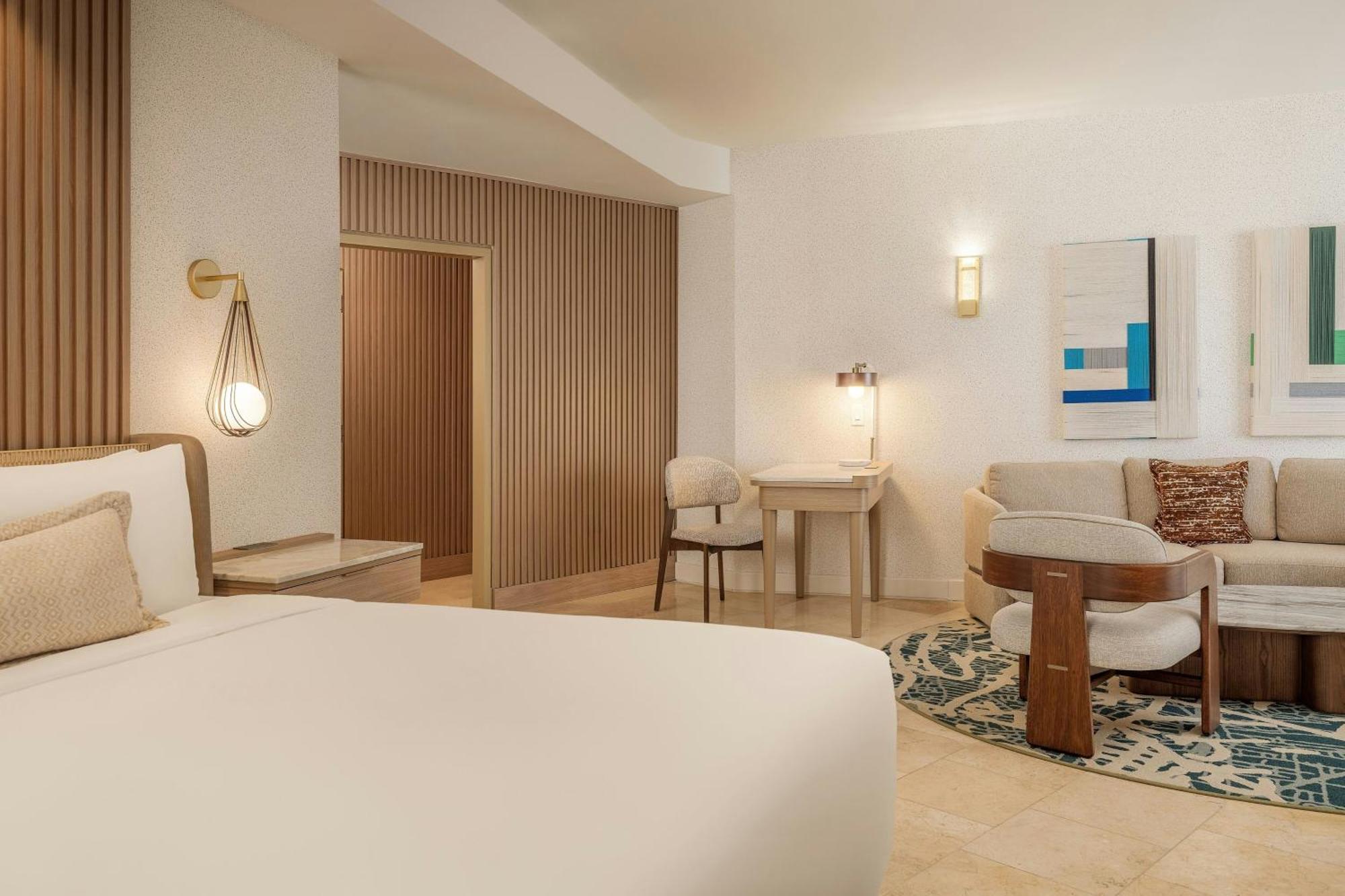 Executive suite king bed balcony partial ocean view